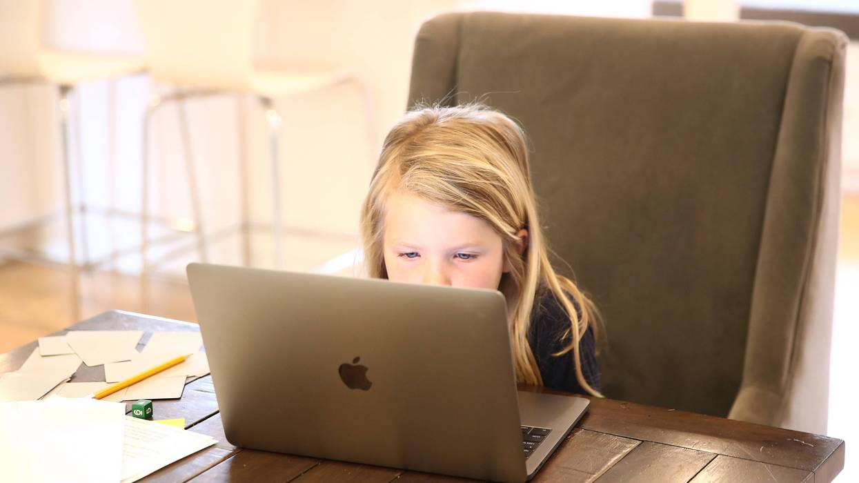 Evianna Van Santvoord, who is in kindergarten, does her schoolwork at home on March 18, 2020 in San Anselmo, California.