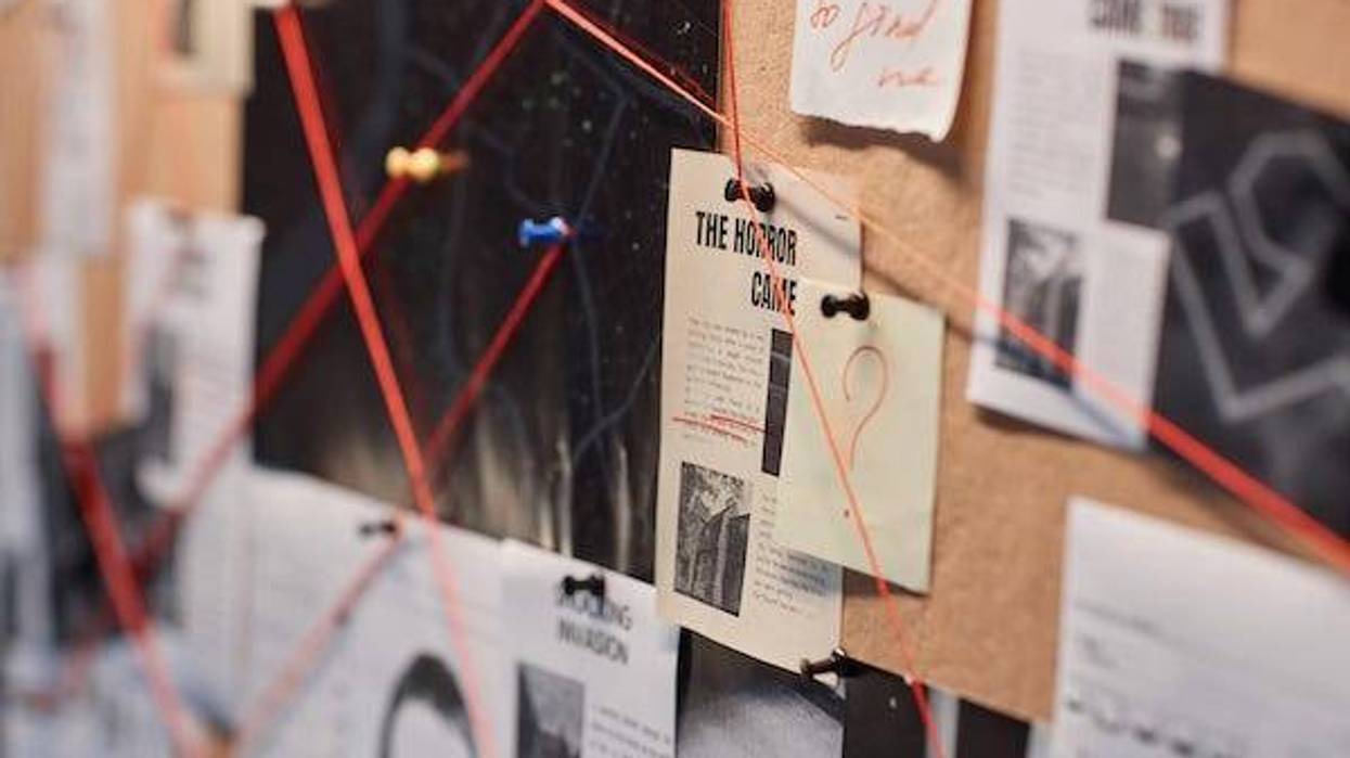 Evidence board with red thread connecting pictures
