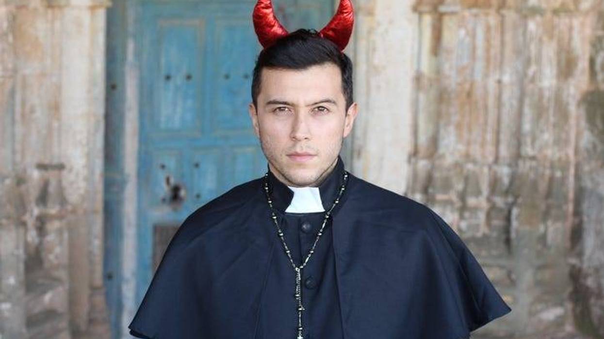 Evil looking priest with horns.