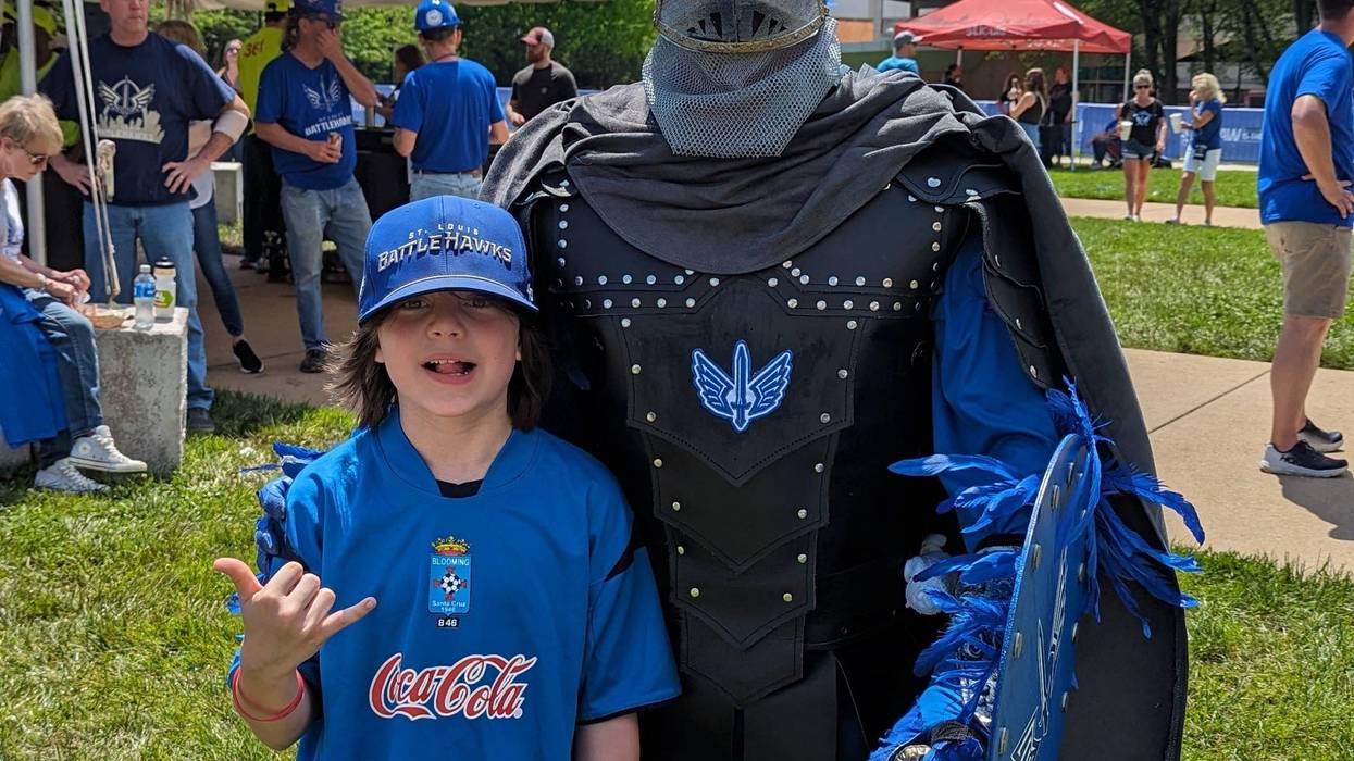 Excaliburd poses with Samuel McMillian a young Battlehawks fan from Barnhart.