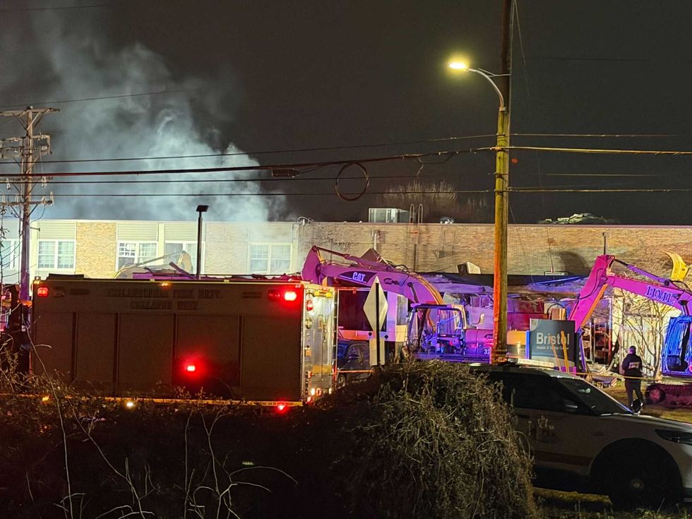 Excavators work to move the rubble at the Silver Lake Nursing Home in Bristol, PA after an explosion and fire.