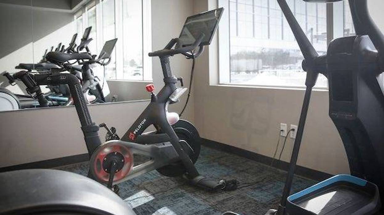 Exercise room with Peloton bikes