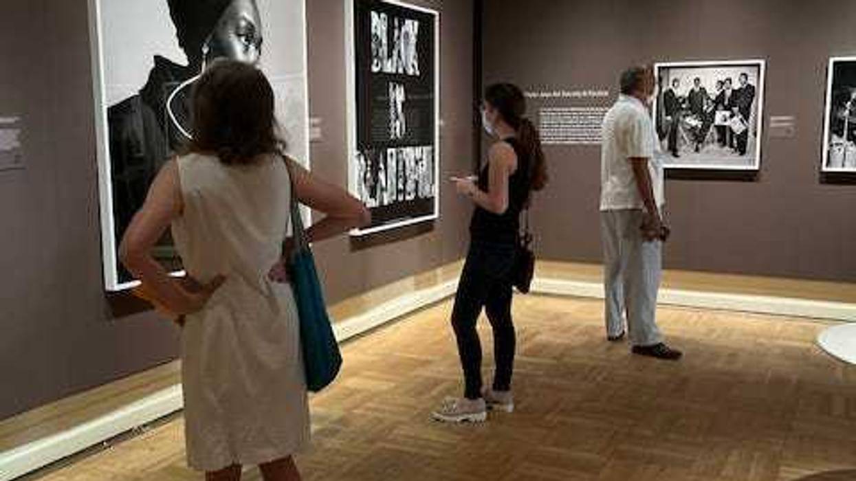 Exhibit-goers view Brathwaite photographs at the opening of the New York Historical Society show.