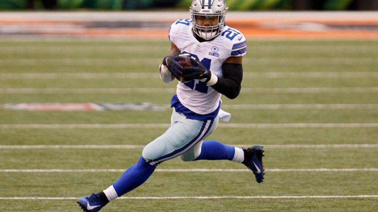 Ezekiel Elliott #21 of the Dallas Cowboys runs with the ball in the second quarter against the Cincinnati Bengals at Paul Brown Stadium on December 13, 2020 in Cincinnati, Ohio.
