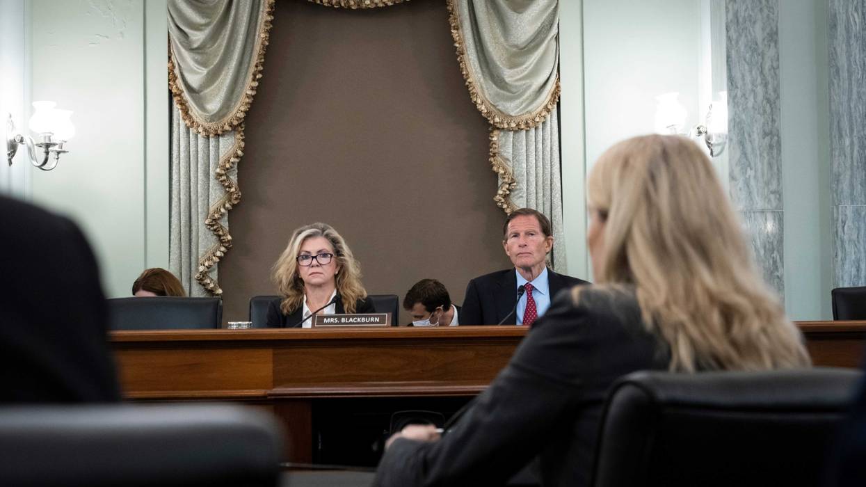 Facebook whistleblower Frances Haugen testifying before a Senate subcommittee, with Sen. Marsha Blackburn (R/TN) and Sen. Richard Blumenthal (D/CT)