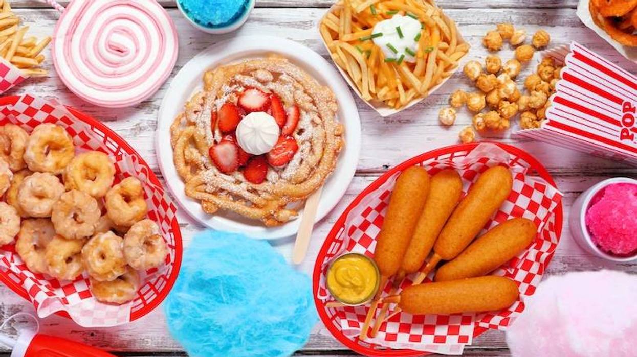Fair and carnival foods displayed on a wooden table