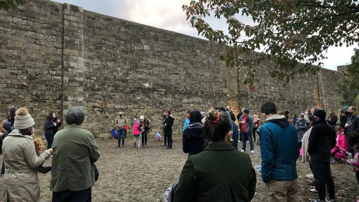 Fairmount residents hold a vigil for Walter Wallace Jr. at Eastern State Penitentiary