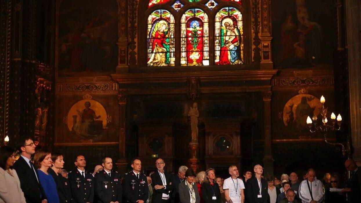 Faithfuls attend a Sunday Mass at the grandiose Saint-Eustache church on the Right Bank of the Seine river in Paris, Sunday, April 21, 2019. The archbishop of Paris and Catholics from around France and the world honored the firefighters who saved Notre Da