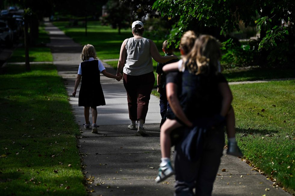 Families depart Annunciation Catholic School following a mass shooting on August 27, 2025 in Minneapolis, Minnesota.