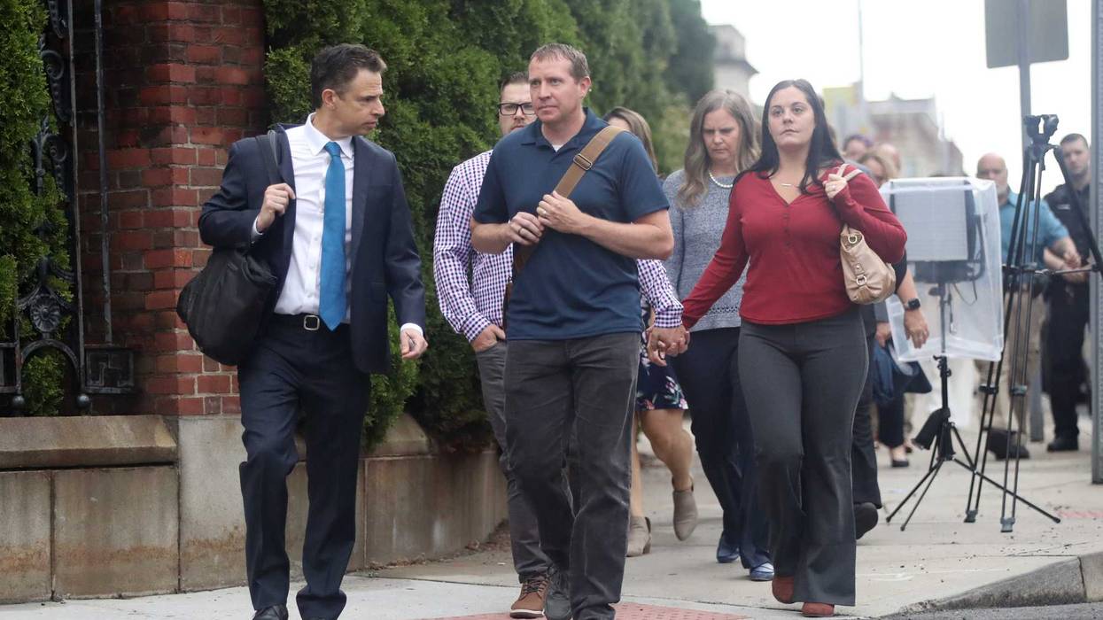 Families of Sandy Hook Elementary School shooting victims walk into Waterbury Superior Court with their lawyer Josh Koskoff (left) at the start of the civil damages trial against Alex Jones, who called the 2012 Sandy Hook shooting a hoax, 9/13/22