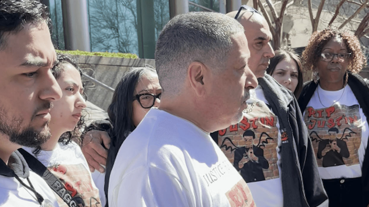 Family and friends of Justin Diaz—including his brother and father, left and center—were outside the courthouse after the hearing, wearing shirts that said, "Justice for Justin"