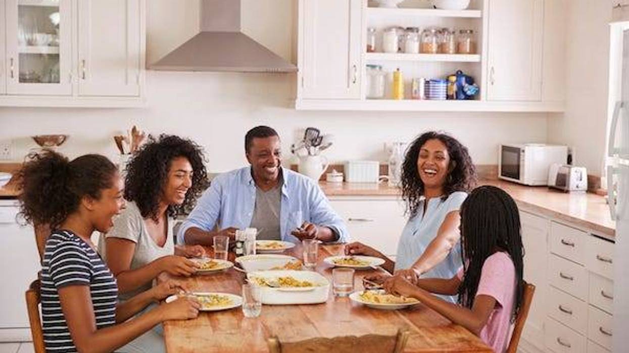 Family having dinner in the kitchen