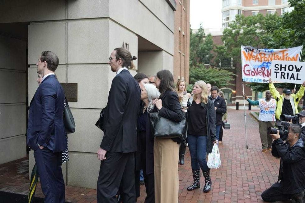 Family of former FBI Director James Comey and others, arrive at federal court in Alexandria, Va., Wednesday, Oct. 8, 2025.