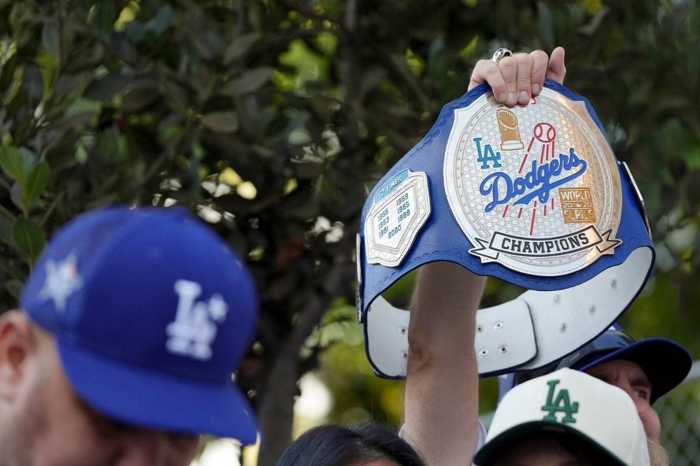 fan holding dodgers championship belt
