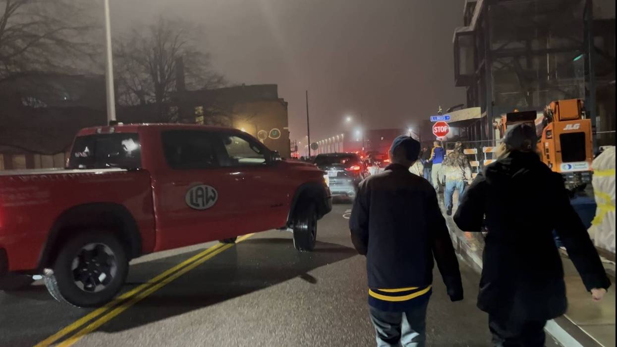 Fans and Cars try to share the road on South Park Ave behind KeyBank Center