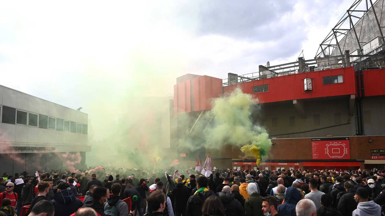 Fans are seen protesting Manchester United's Glazer ownership outside the stadium prior to the Premier League match at Old Trafford, 5/2/21.
