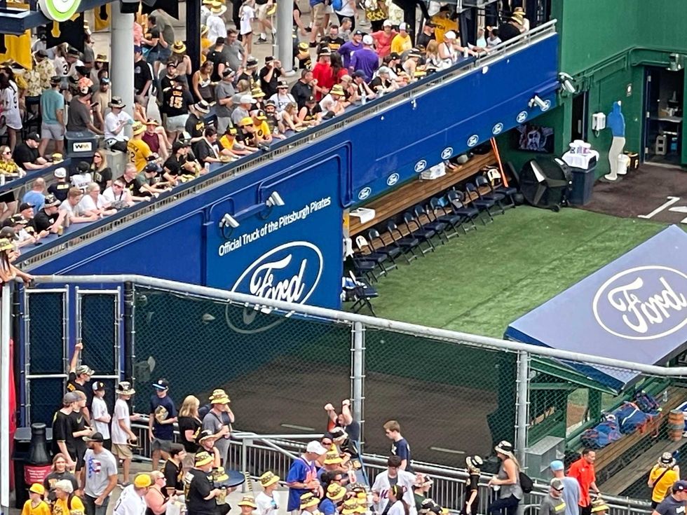 Fans around the bullpen with Skenes pitching