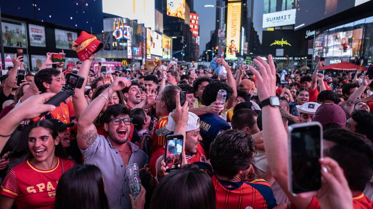 Fans celebrate following Spain's FIFA World Cup 2026 Final win against Argentina, in New York's Times Square.