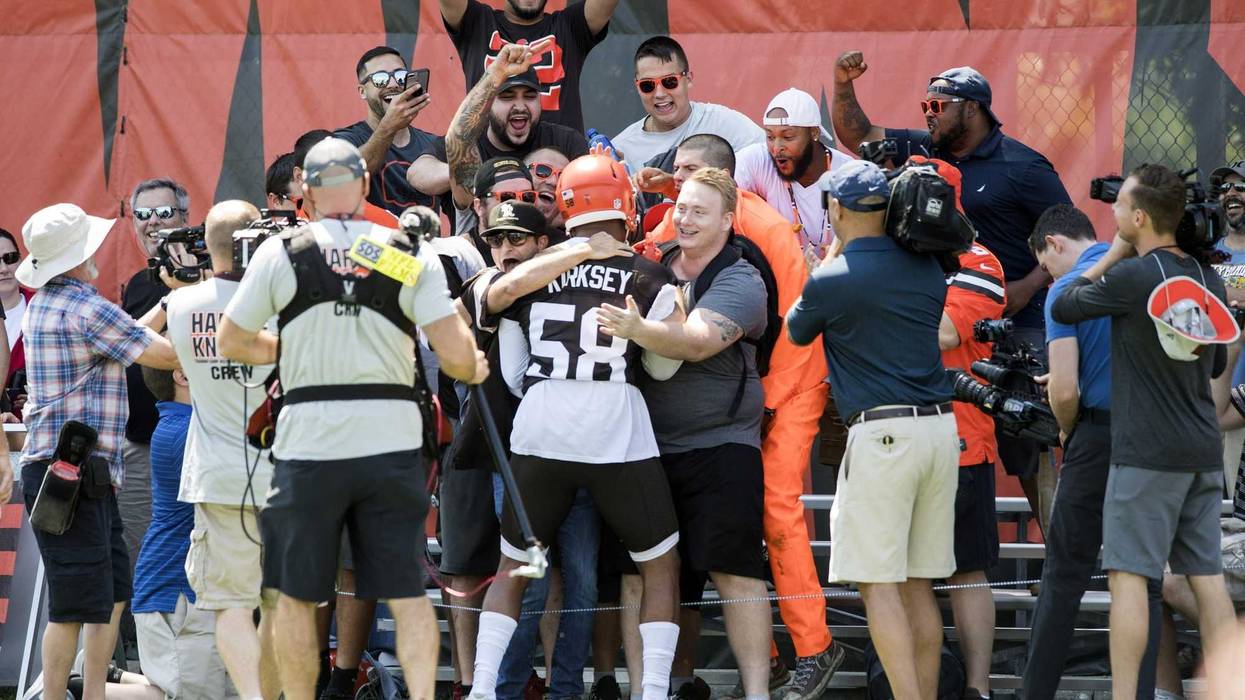 Fans greet Cleveland Browns linebacker Christian Kirksey (58) during training camp at the Cleveland Browns Training Complex.