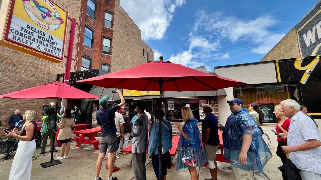Fans line up for free Wieners Circle hot dogs