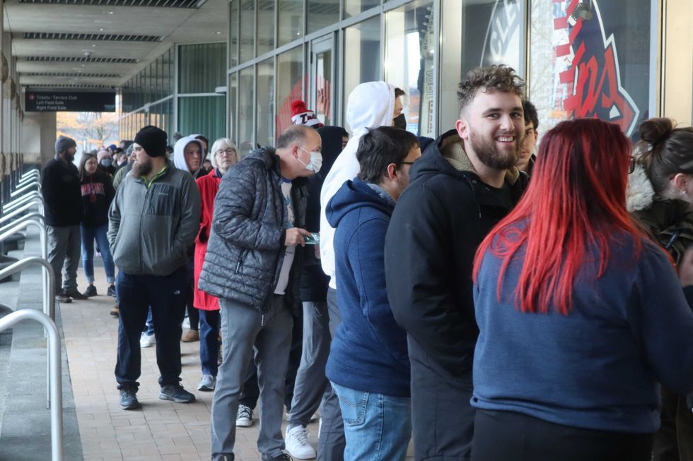 Fans line up just before the 9 a.m. opening of the Cleveland Guardians