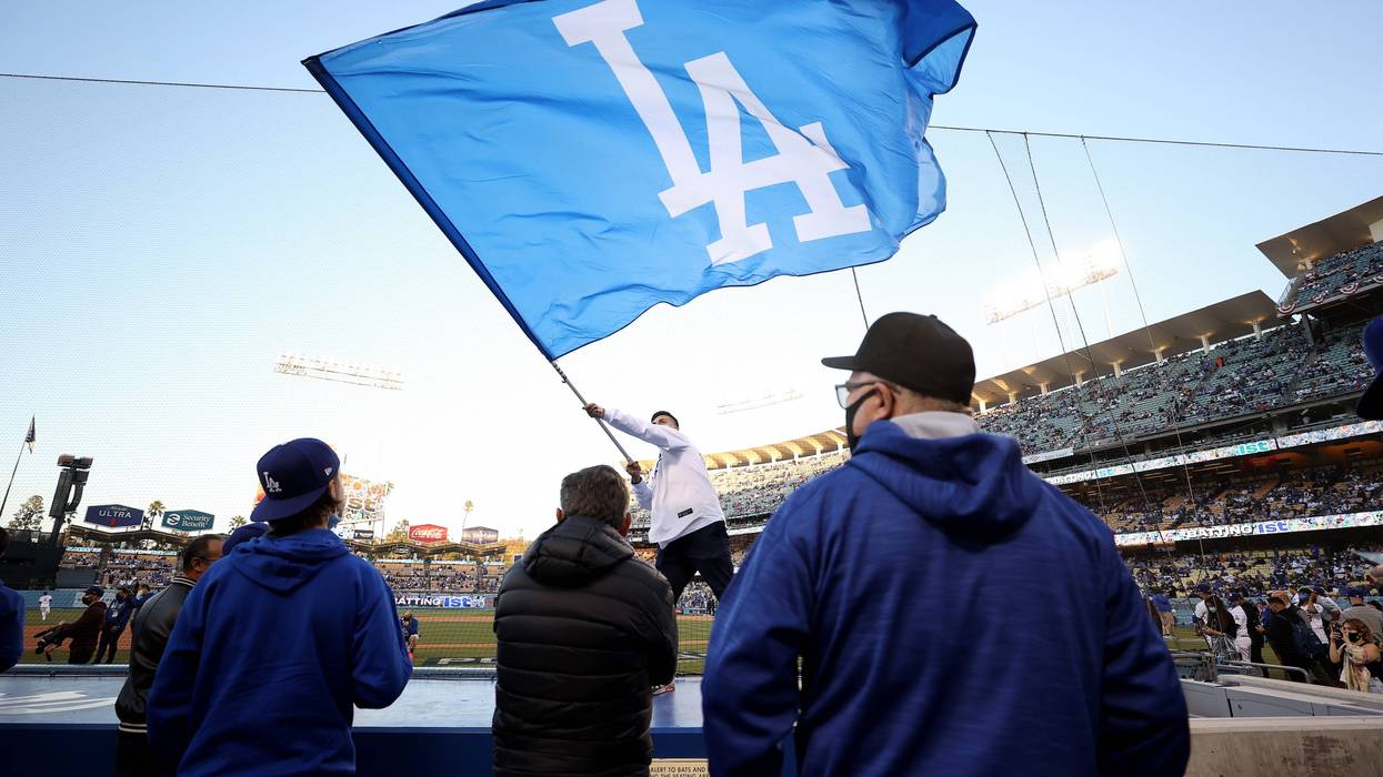 Fans look on during game 4 of the National League Division Series between the Los Angeles Dodgers and the San Francisco Giants at Dodger Stadium on October 12, 2021 in Los Angeles, California.
