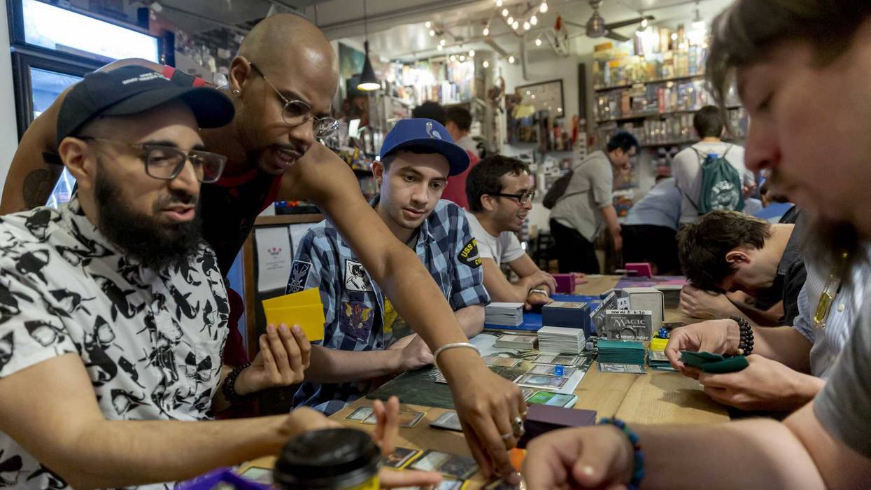 Fans play a Magic: The Gathering card game during a weekly tournament at the Uncommons hobby shop in New York, U.S., on Thursday, June 27, 2019.