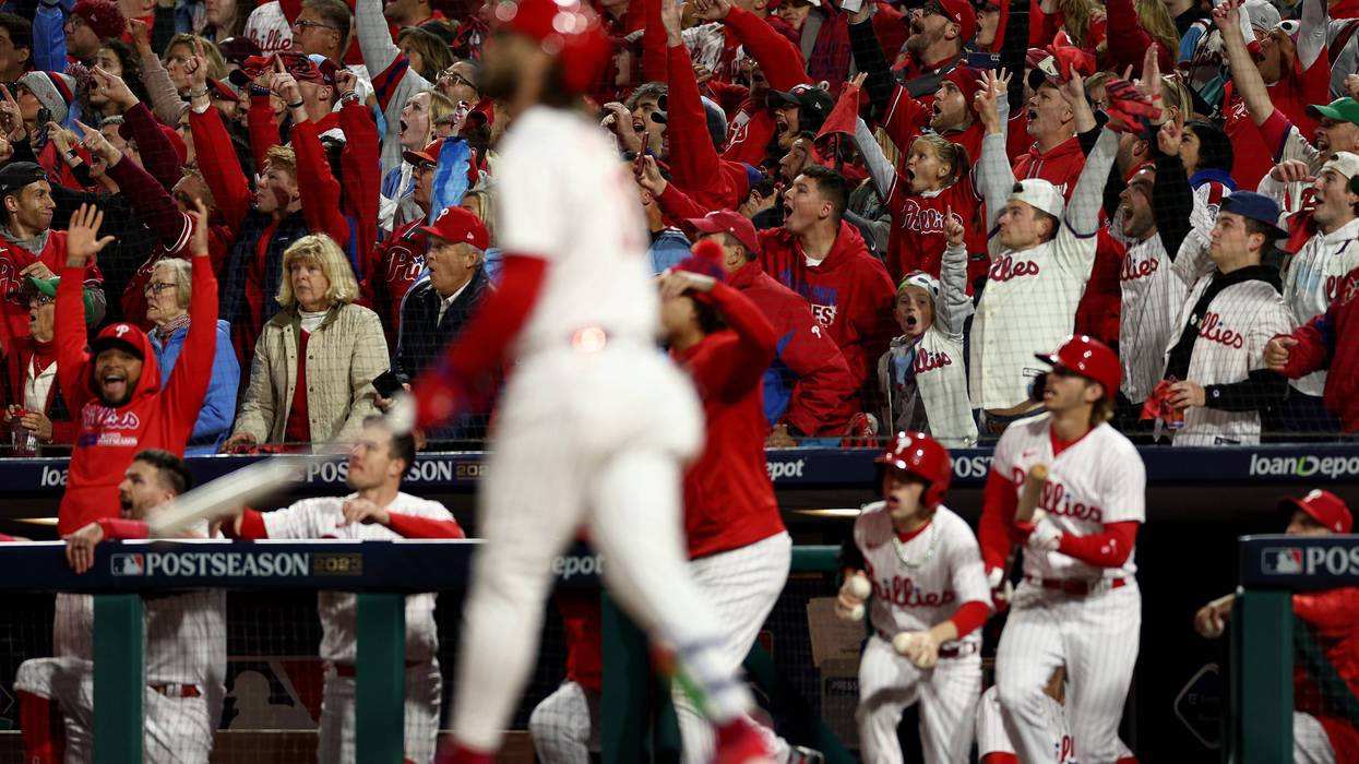 Fans react as Bryce Harper of the Phillies hits a solo home run in the first inning against the Arizona Diamondbacks during Game One of the Championship Series at Citizens Bank Park on Oct. 16.