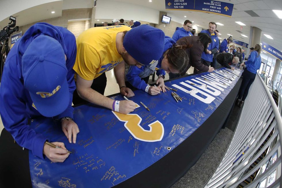 fans signing banner for Damar Hamlin