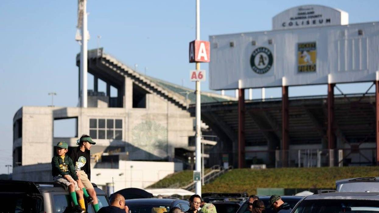Fans tailgate before the Oakland Athletics play the Texas Rangers at the Oakland Coliseum on September 24, 2024 in Oakland, California.