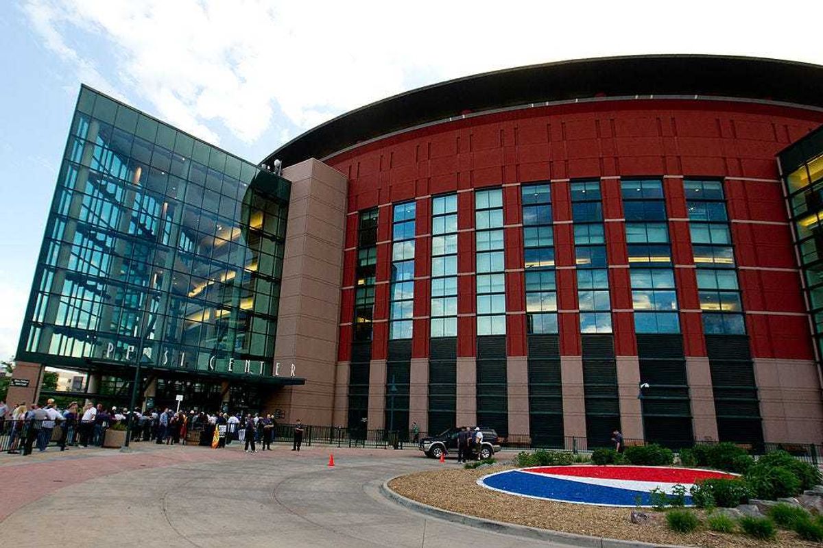 Fans wait in line outside Ball Arena.