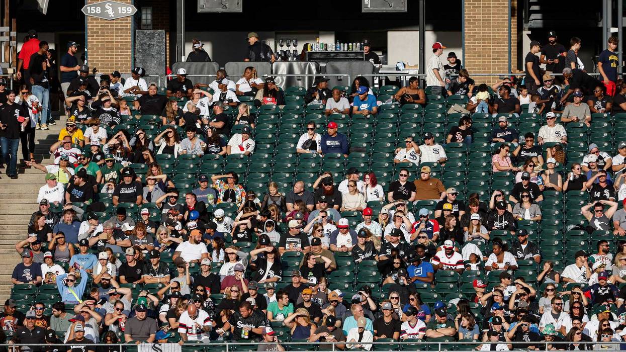 Fans watch a baseball game between the Chicago White Sox and Oakland Athletics from the left-field bleachers during the first inning at Guaranteed Rate Field.