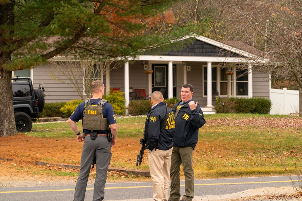FBI and police with the Joint Terrorist Task Force surround the home of Gregory Yetman on Main Street in Helmetta to execute an arrest warrant for his alleged role in the Jan. 6 Capitol riots