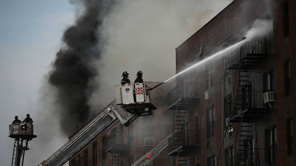 FDNY firefighters extinguishing a fire in Brooklyn. Not the specific fire that killed two sisters in 2021.