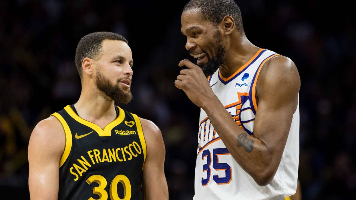 Feb 10, 2024; San Francisco, California, USA; Golden State Warriors guard Stephen Curry (30) and Phoenix Suns forward Kevin Durant (35) talk during the second half at Chase Center.