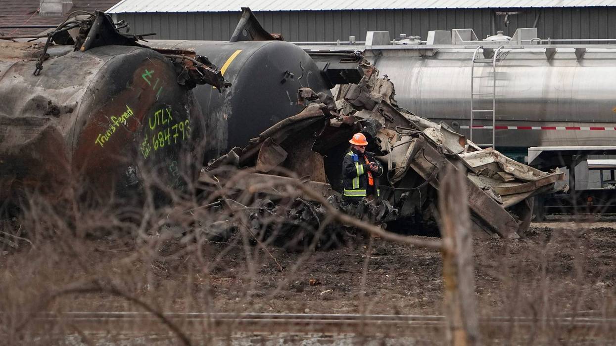 Feb 20, 2023; East Palestine, Ohio, USA; Workers clean up the wreckage of the Norfolk Southern train derailment in East Palestine.