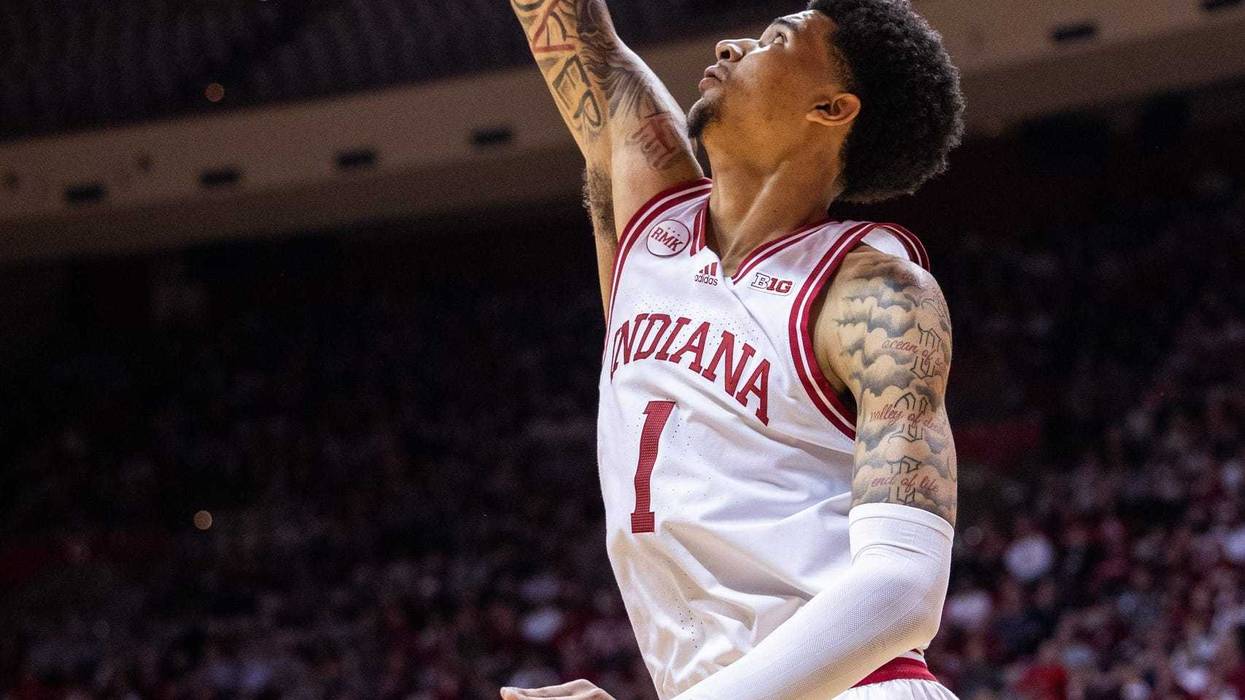 Feb 21, 2024; Bloomington, Indiana, USA; Indiana Hoosiers center Kel'el Ware (1) shoots the ball while Nebraska Cornhuskers guard Keisei Tominaga (30) defends in the first half at Simon Skjodt Assembly Hall. Mandatory Credit: Trevor Ruszkowski-USA TODAY Sports