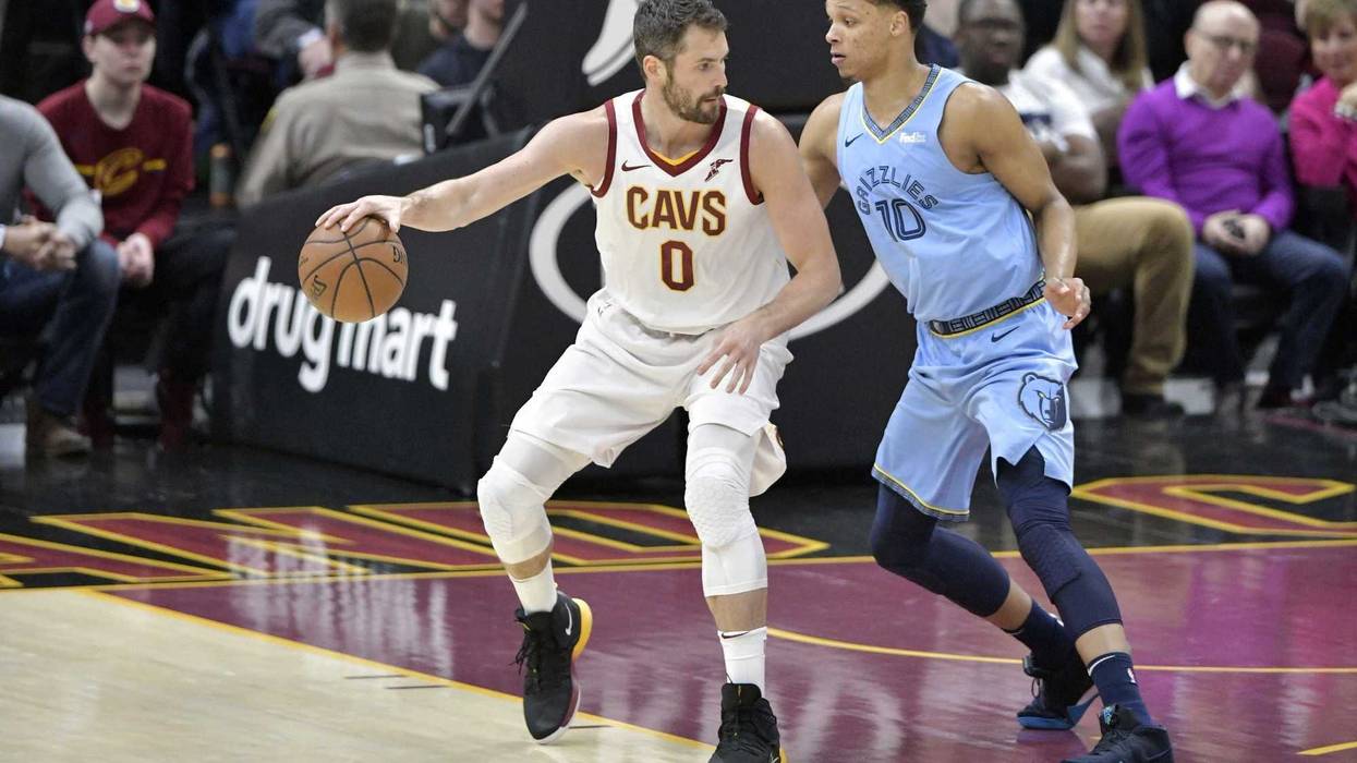 Feb 23, 2019; Cleveland, OH, USA; Cleveland Cavaliers forward Kevin Love (0) dribbles against Memphis Grizzlies forward Ivan Rabb (10) in the first quarter at Quicken Loans Arena. Mandatory Credit: David Richard-USA TODAY Sports