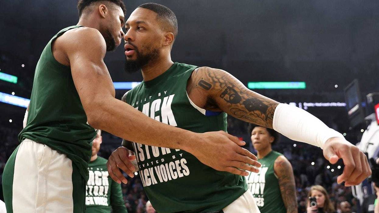 Feb 23, 2024; Minneapolis, Minnesota, USA; Milwaukee Bucks guard Damian Lillard (0) and forward Giannis Antetokounmpo (34) shake hands before the start of the game against the Minnesota Timberwolves at Target Center. Mandatory Credit: Matt Krohn-Imagn Images