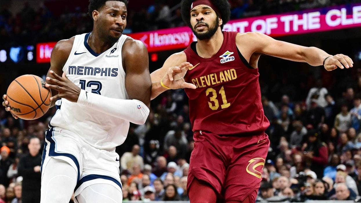 Feb 23, 2025; Cleveland, Ohio, USA; Memphis Grizzlies forward Jaren Jackson Jr. (13) drives to the basket against Cleveland Cavaliers center Jarrett Allen (31) during the second half at Rocket Arena