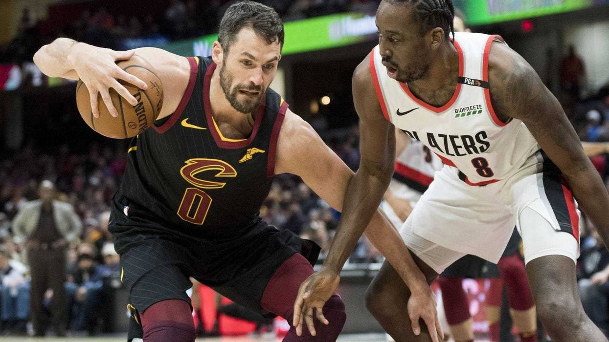Feb 25, 2019; Cleveland, OH, USA; Portland Trail Blazers forward Al-Farouq Aminu (8) defends Cleveland Cavaliers forward Kevin Love (0) during the first half at Quicken Loans Arena. Mandatory Credit: Ken Blaze-USA TODAY Sports