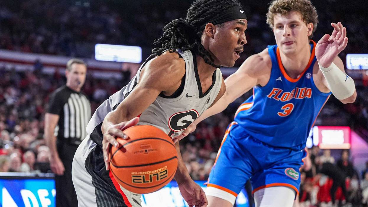 Feb 25, 2025; Athens, Georgia, USA; Georgia Bulldogs guard Silas Demary Jr. (5) dribbles against Florida Gators center Micah Handlogten (3) during the first half at Stegeman Coliseum. Mandatory Credit: Dale Zanine-Imagn Images