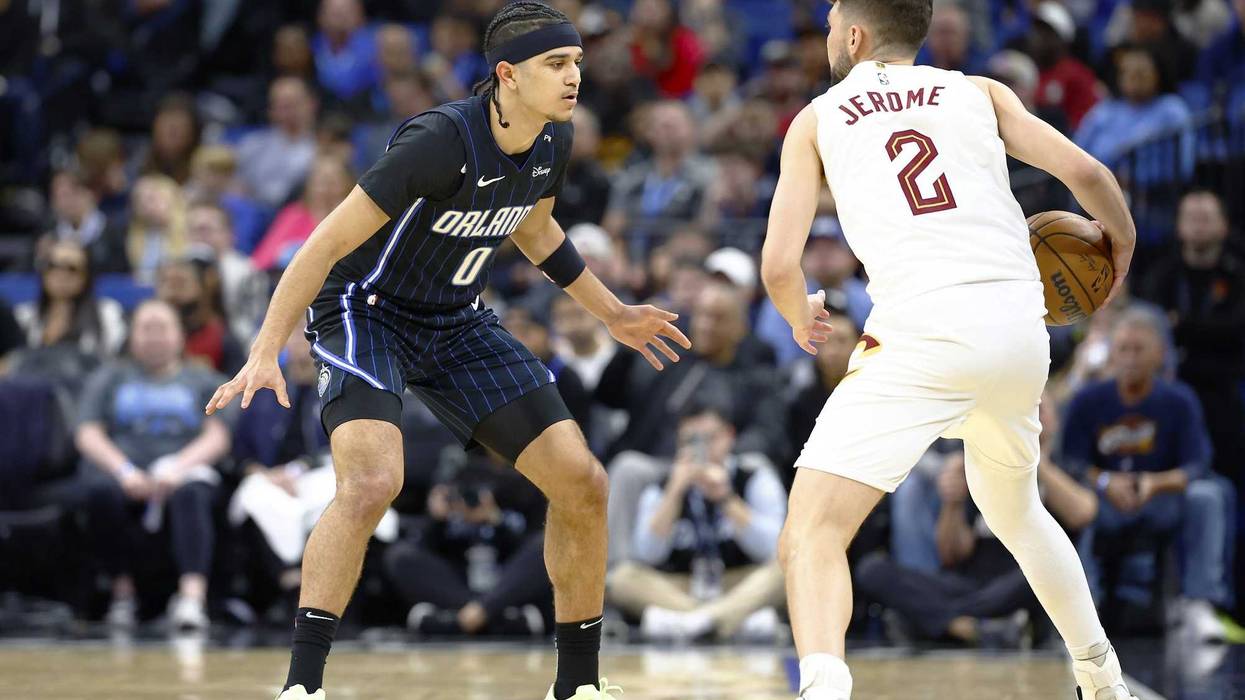 Feb 25, 2025; Orlando, Florida, USA; Orlando Magic guard Anthony Black (0) guards Cleveland Cavaliers guard Ty Jerome (2) during the first half at Kia Center.