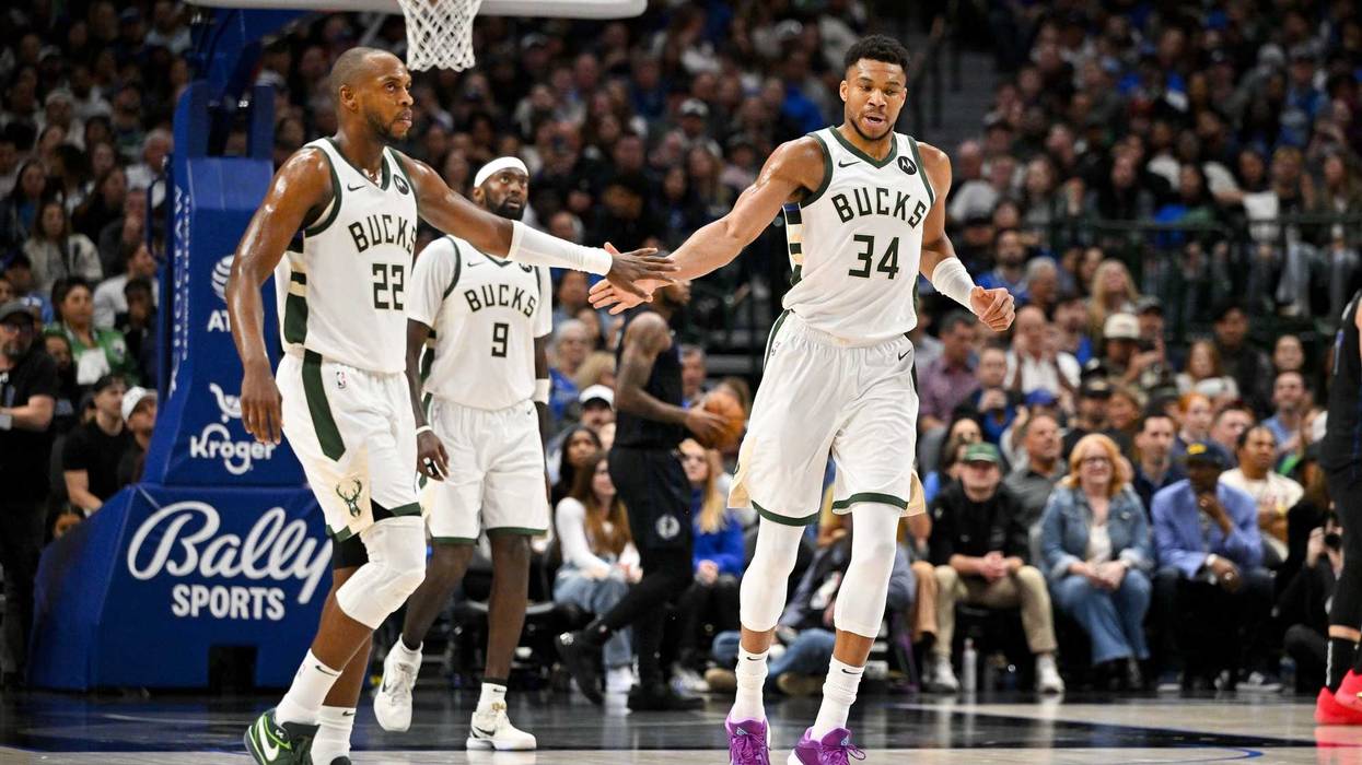 Feb 3, 2024; Dallas, Texas, USA; Milwaukee Bucks forward Khris Middleton (22) and forward Giannis Antetokounmpo (34) during the game between the Dallas Mavericks and the Milwaukee Bucks at the American Airlines Center. Mandatory Credit: Jerome Miron-Imagn Images