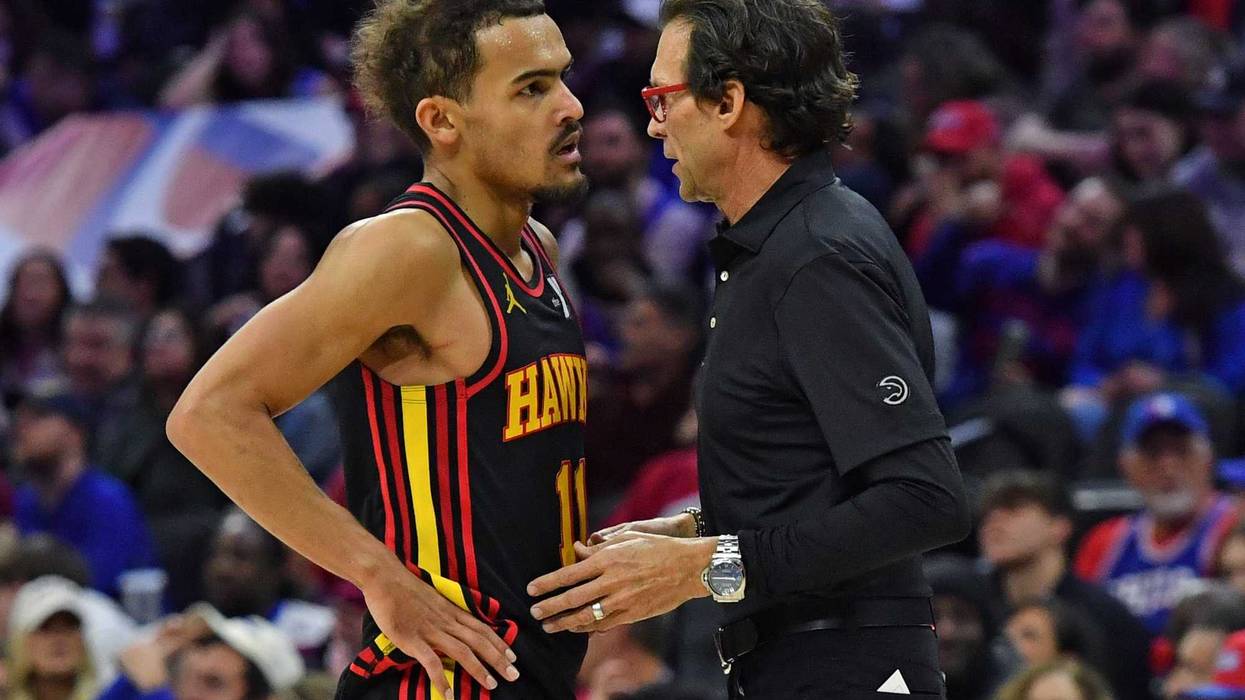 Feb 9, 2024; Philadelphia, Pennsylvania, USA; Atlanta Hawks head coach Quin Snyder talks with guard Trae Young (11) against the Philadelphia 76ers during the fourth quarter at Wells Fargo Center. Mandatory Credit: Eric Hartline-Imagn Images