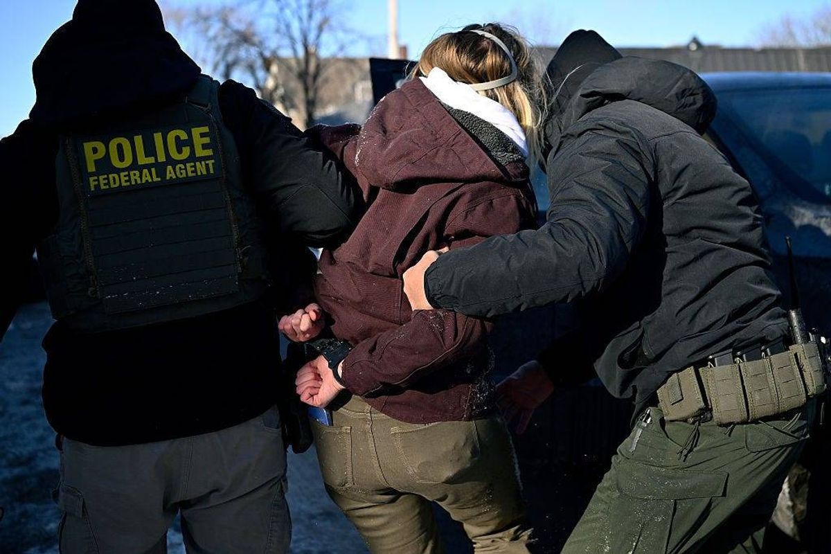 Federal agent detain a person at Portland Ave and 19th St. on January 29, 2026 in Minneapolis, Minnesota.