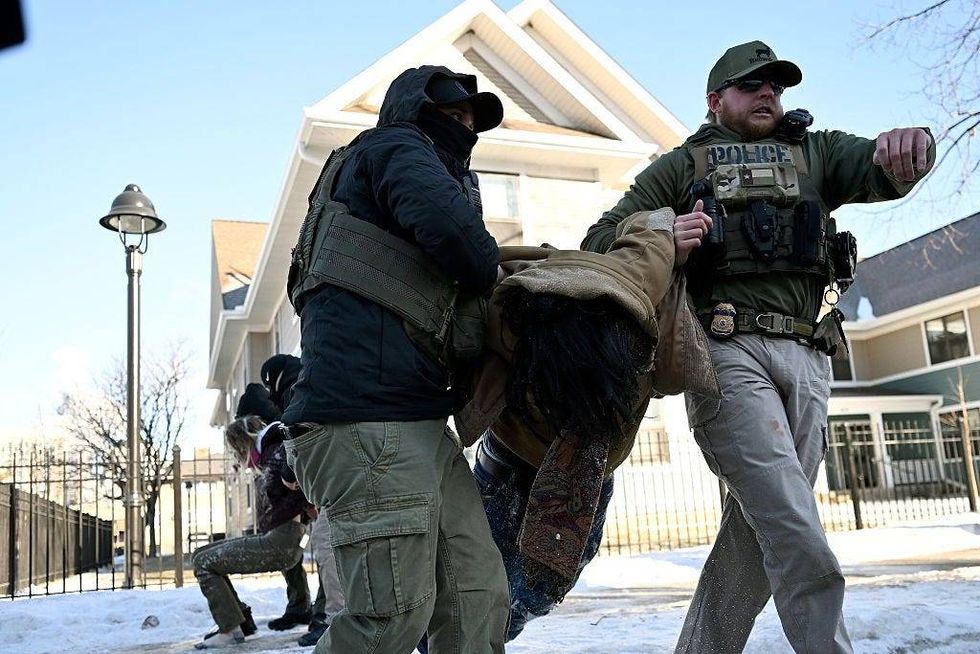 Federal agent detain two people at Portland Ave and 19th St. on January 29, 2026 in Minneapolis, Minnesota.