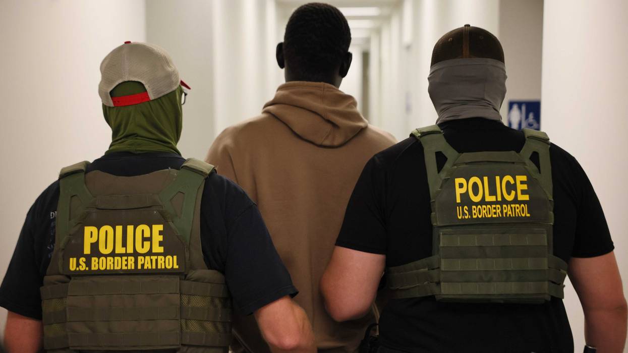 Federal agents detain a man after his court hearing in immigration court at the Ted Weiss Federal Building in New York City, on July 9.