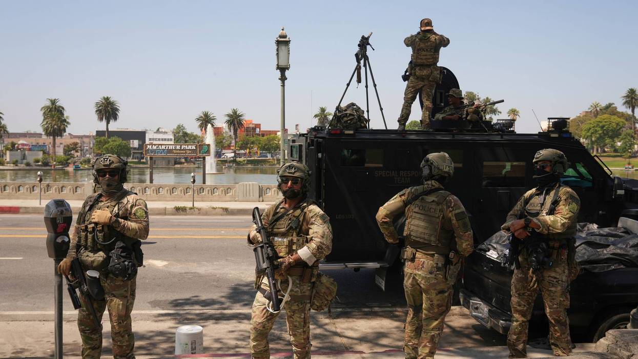 Federal agents stage at MacArthur Park Monday, July 7, 2025, in Los Angeles.