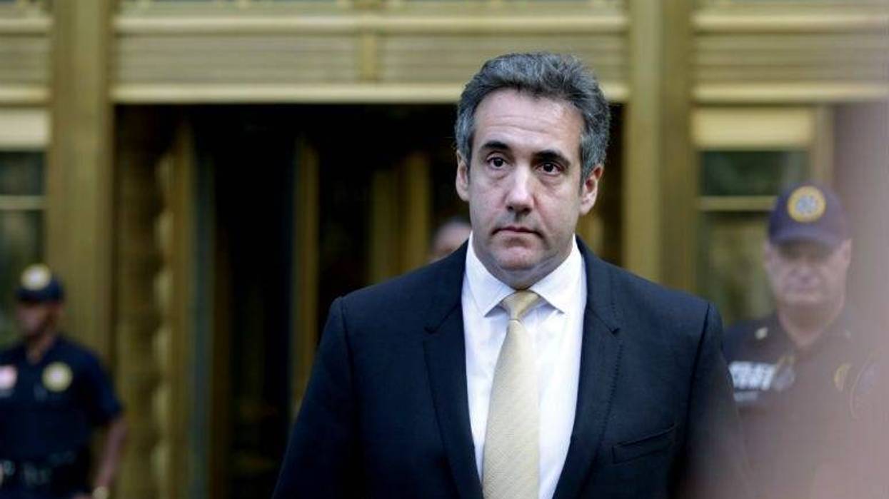 Federal prosecutors have charged an analyst with the Internal Revenue Service with illegally disclosing confidential reports about Michael Cohen's bank records that revealed that President Donald Trump's former lawyer sought to profit from his proximity t